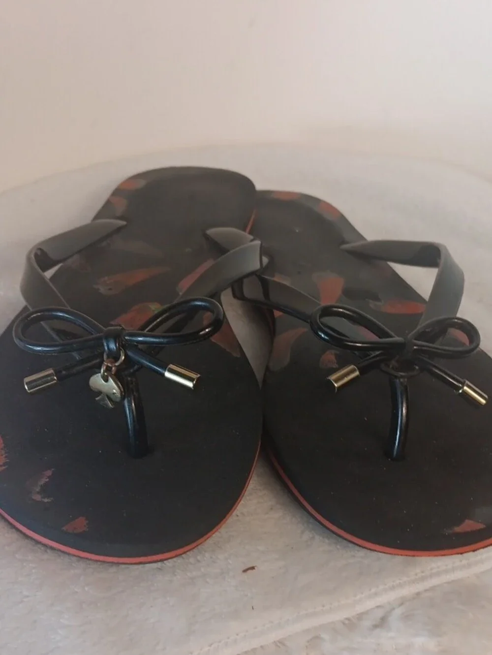kate spade Black Flip Flop Sandals with Red Pepper Print and Bow